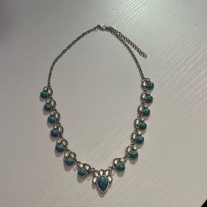 Never worn, from a boutique, mostly turquoise in this crystal look.